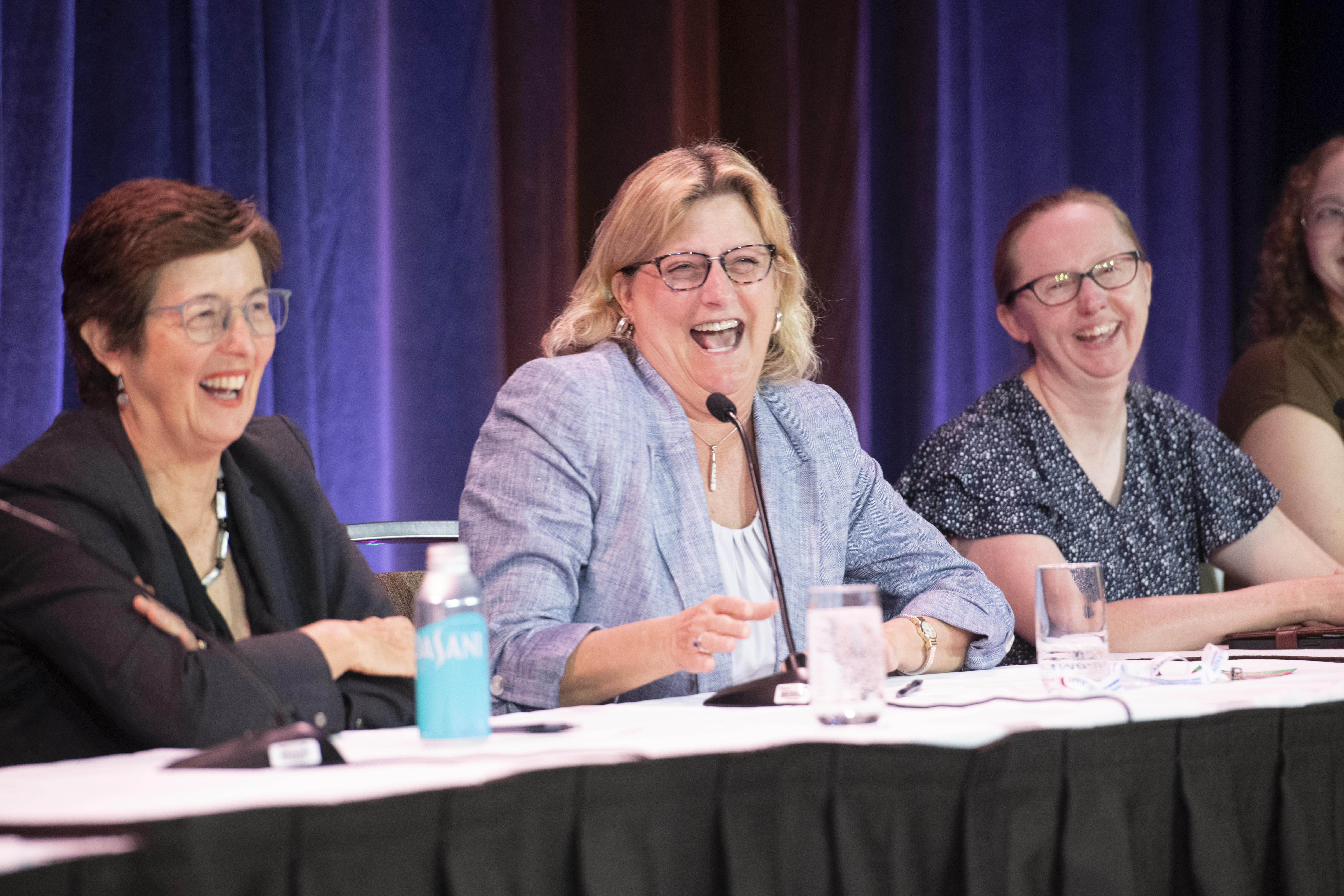 Speakers at ASBMR2025 laughing